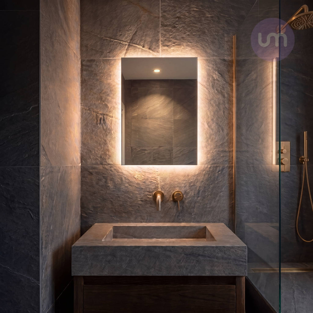 Tempus 400 x 600 mm backlit LED mirror – glowing warm white 2700K in a dark slate bathroom with stone trough basin